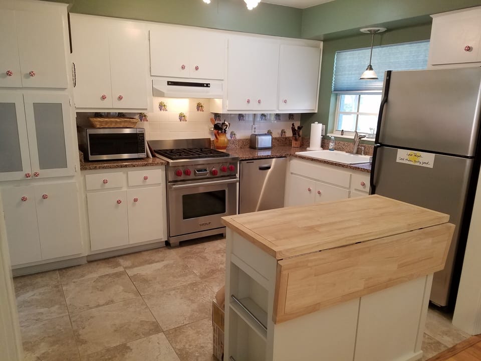 The gourmet kitchen, complete with Wolf gas stove and stainless appliances