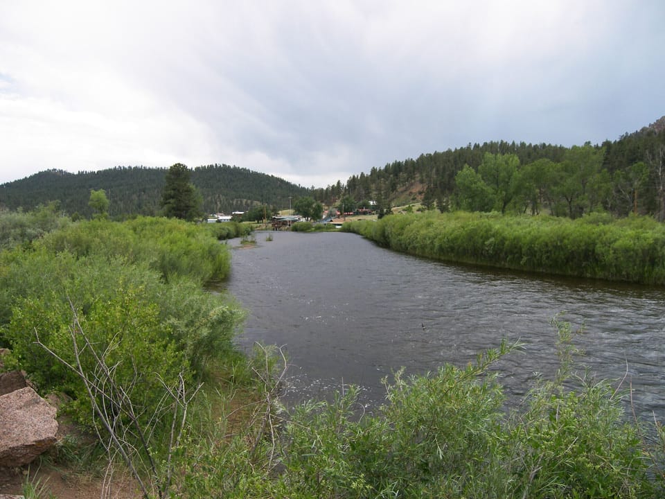 River section in front of cabin. Cabin in background