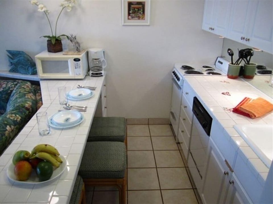 Fully Equipped Kitchen with Bar Counter that seats four.