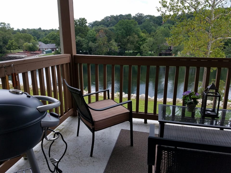 Your covered deck with lake view and grill