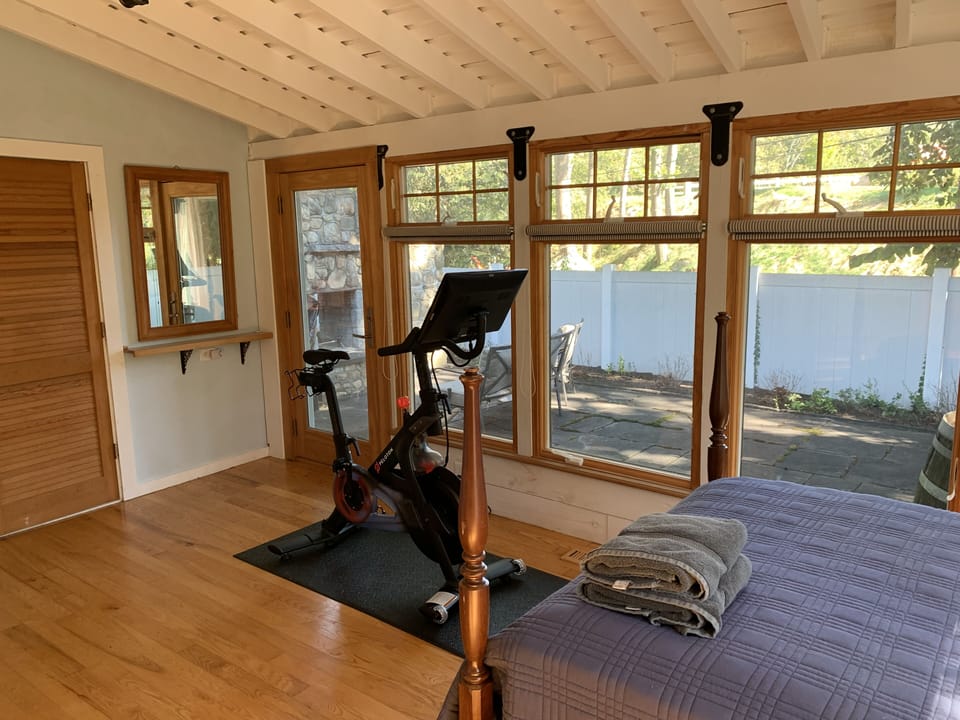 Private patio and outdoor fireplace off of Bedroom 4 (with Peloton bike)