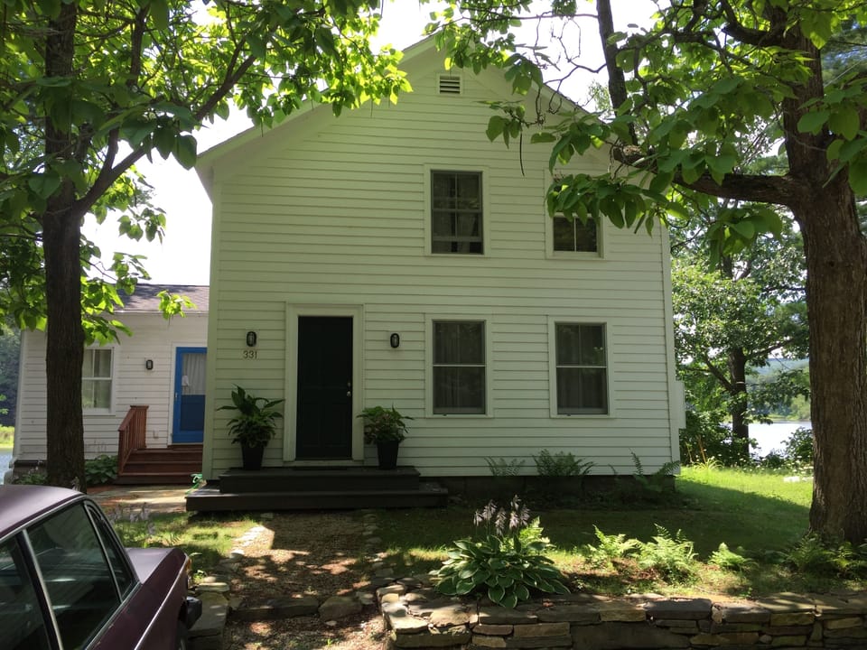 Yor private entry is the black/green door at front of the house.