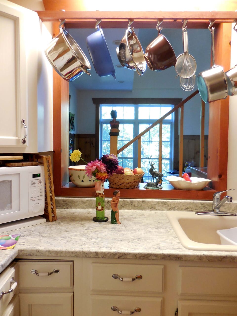Looking from kitchen into dining area and beyond.