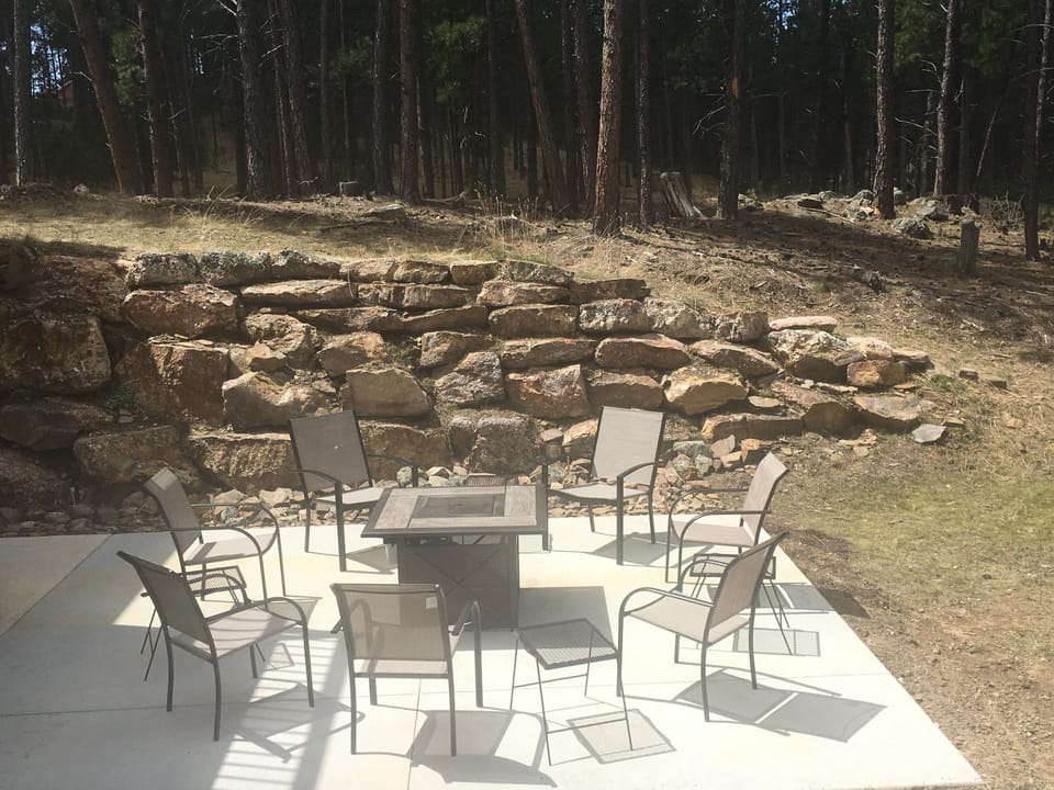 Gather around the propane-fueled fire table in the back yard.