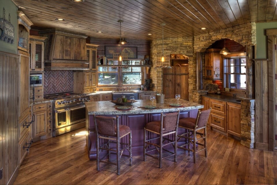 Kitchen is loaded with amenities and has a separate cocktail prep area with pass- through to the porch.