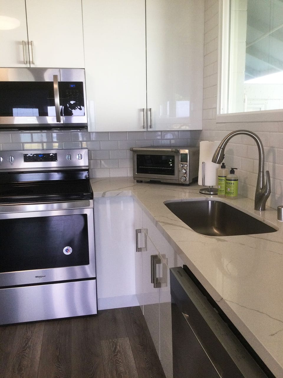 The kitchen with full-sized frig, dishwasher, and small appliances.
