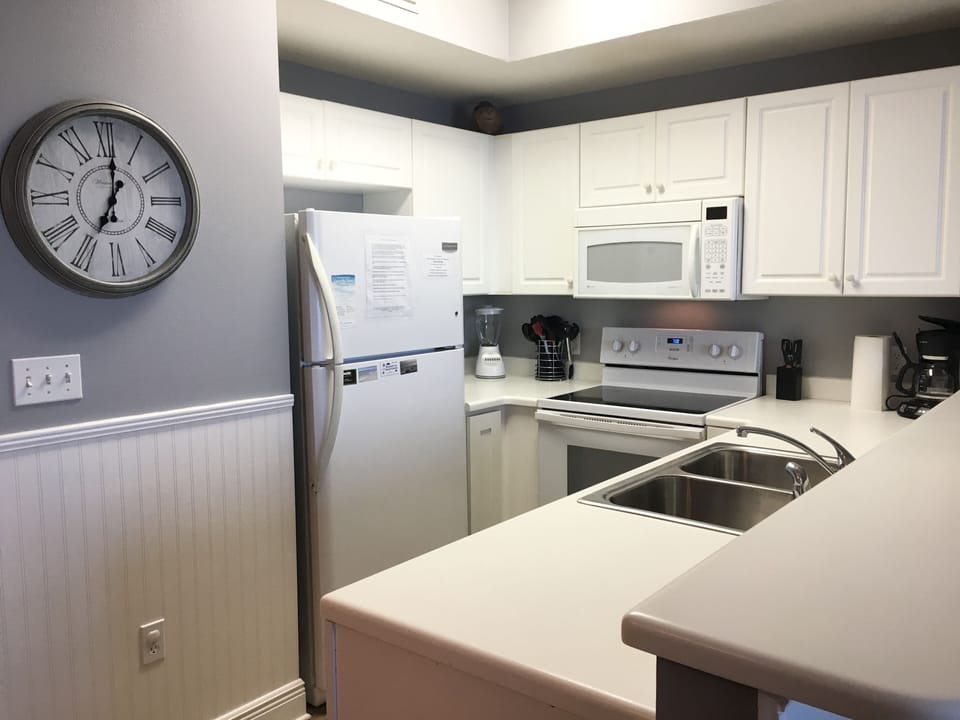 Newer quiet dishwasher, new stove & microwave in fully stocked kitchen.