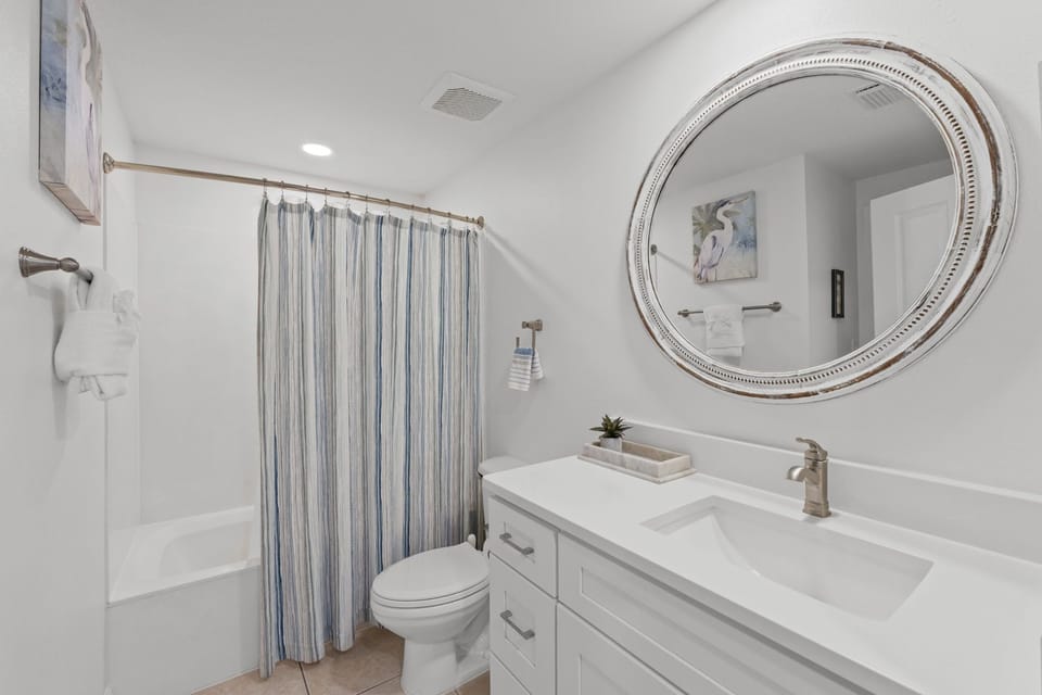 Guest bath updated, new cabinetry, sink, quartz, faucet, fan, mirror 