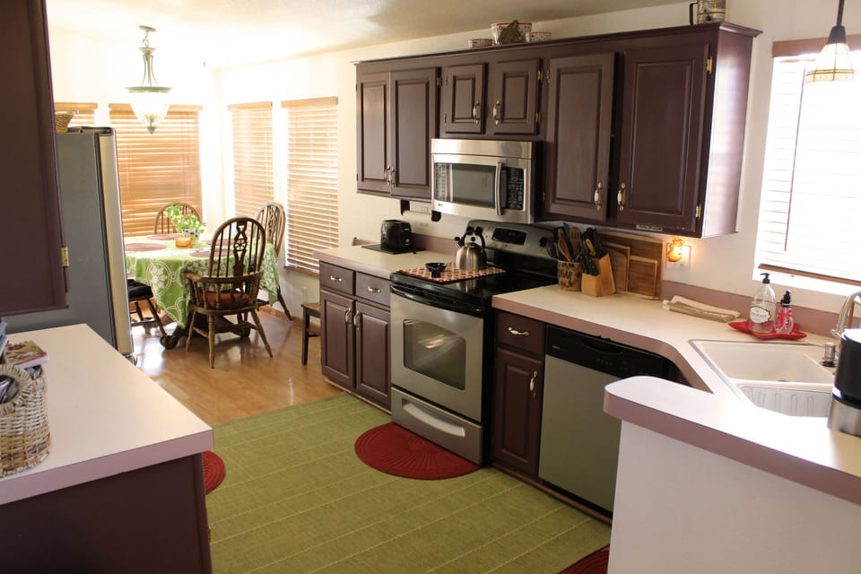 kitchen, toaster, coffee maker, crock pot, blender, espresso maker, pots, pans