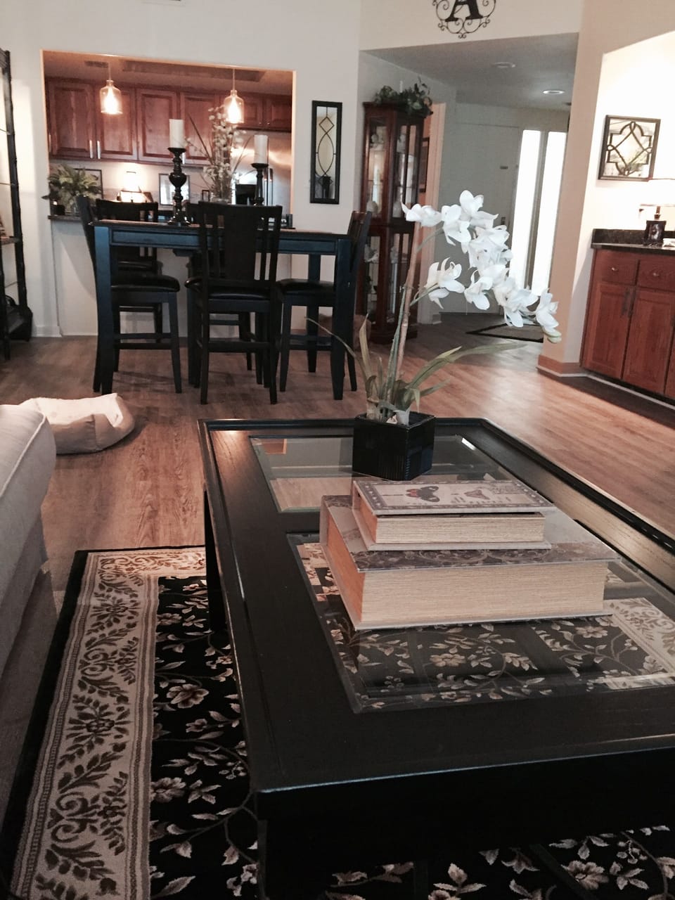 view from living room to dinning room and kitchen