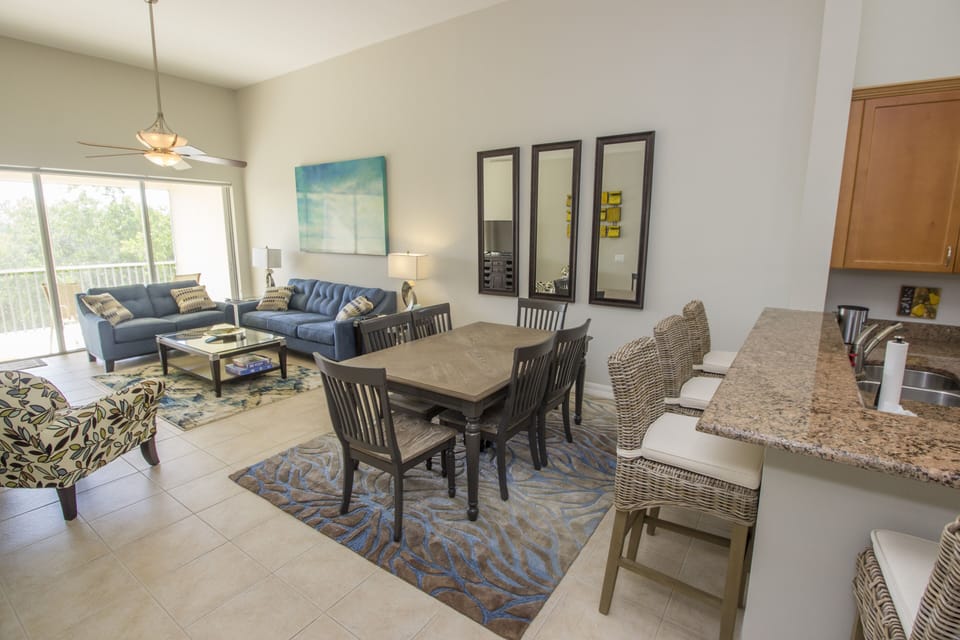 Dining Room area with seating for 6 at the table and 4 at the breakfast bar