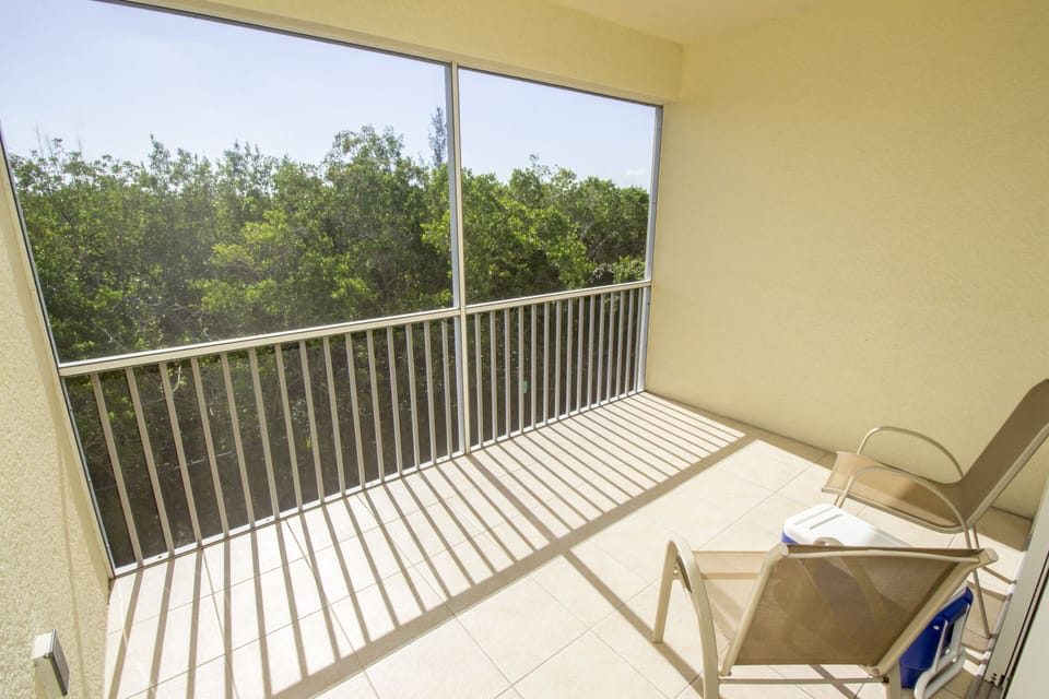 Lanai is screened with a table (not pictured) and seating for eight