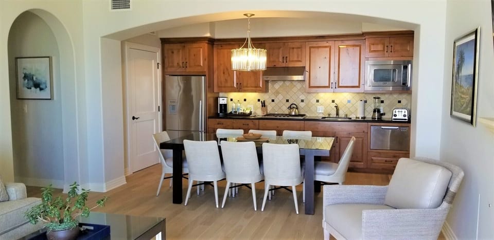 Fully Equipped Chef's Kitchen & Dining Room opens to Living Room & Ocean Views