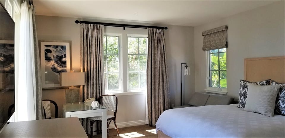Kng Suite with twin sleeper, desk, and private ocean view balcony