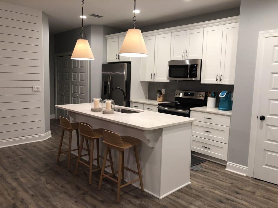 Kitchen with large kitchen island and all of the amenities