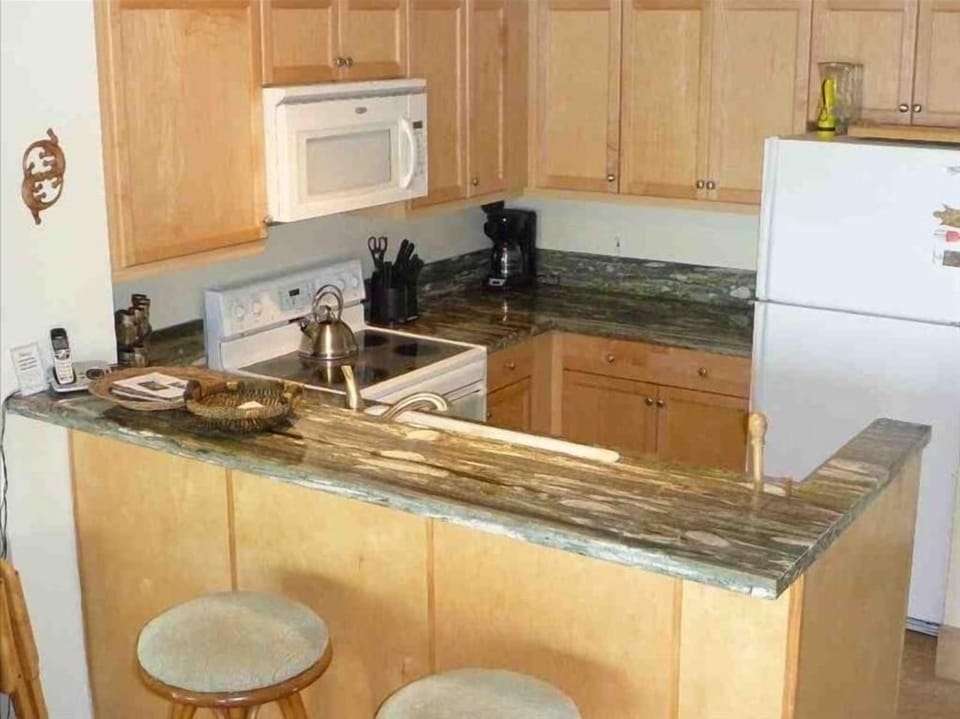 The remodeled Kitchen is stocked with everything but your groceries!