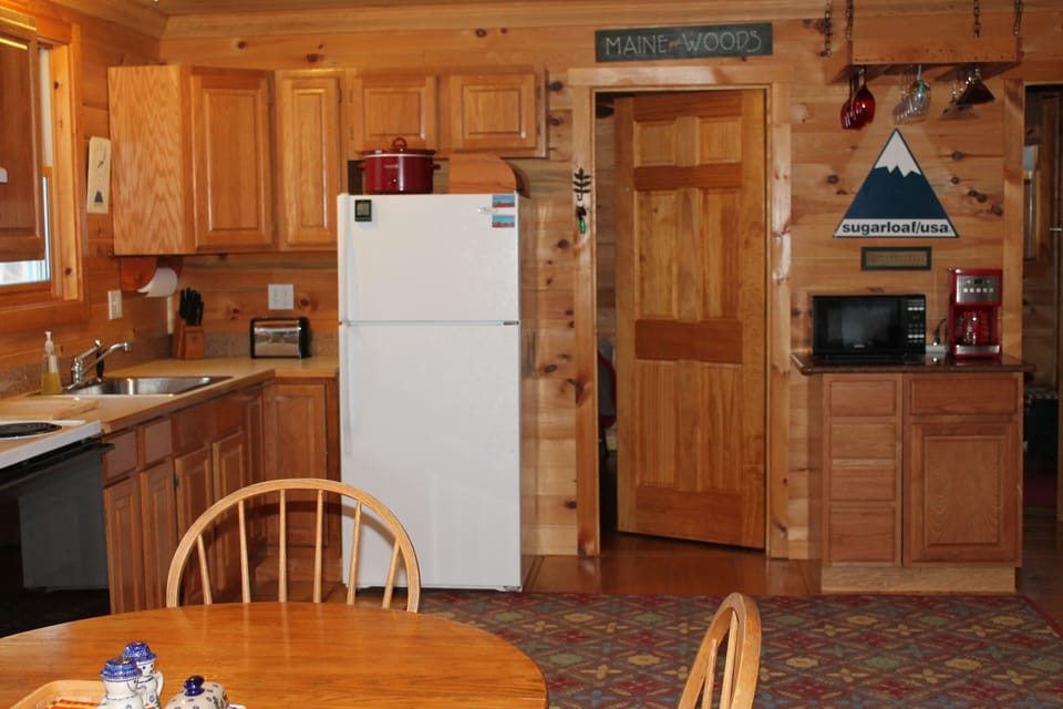 Kitchen area, with master bedroom door leading to bedroom