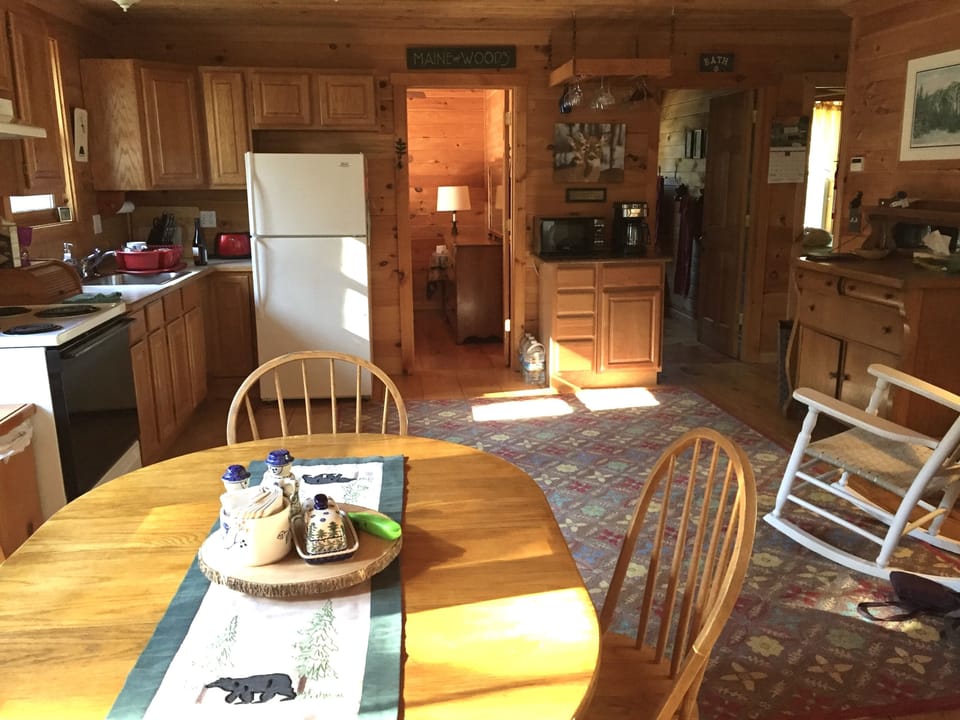 Kitchen area visible, LR to right, bedrooms toward back ahead and right.
