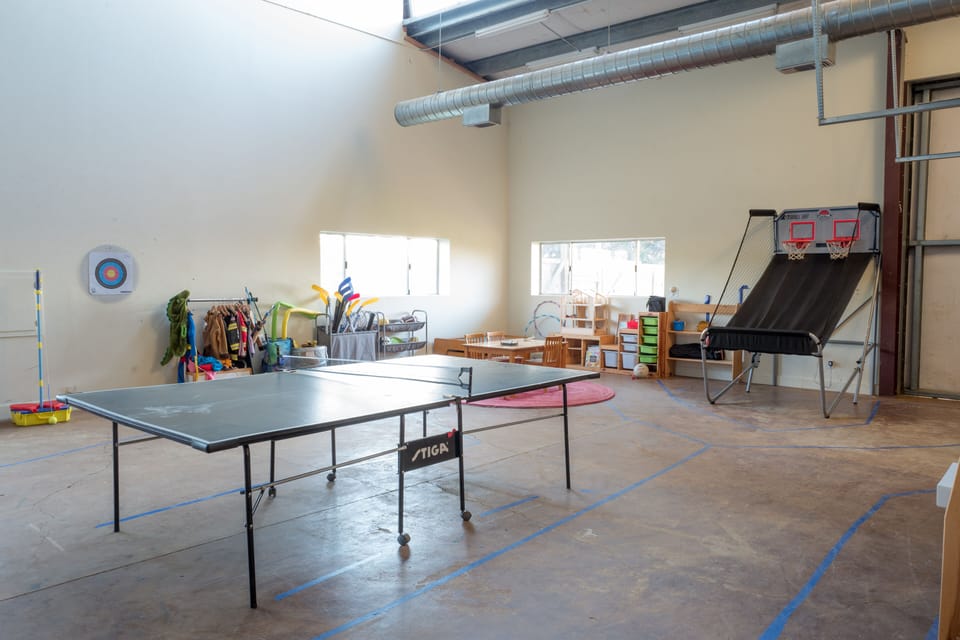 Attached 1000 sqft game room with garden access.