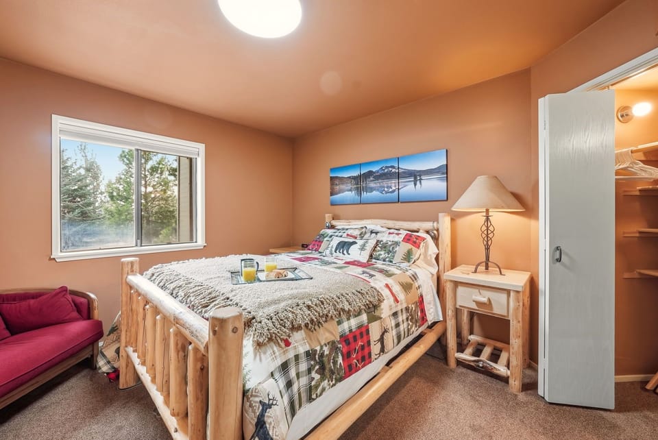Cozy queen bedroom with forest views and rustic charm complete with massager 