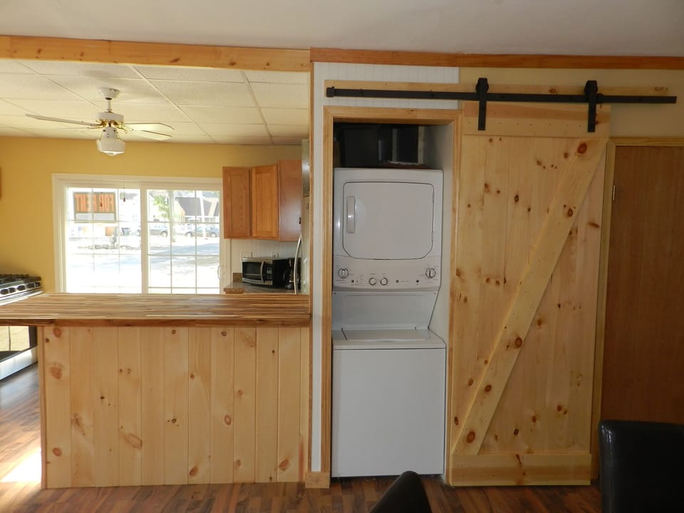 Concealed washer and dryer on 1st floor.