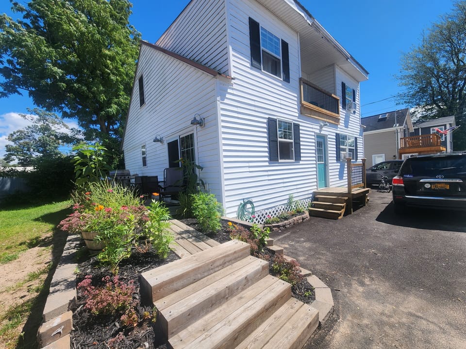 Front and left side. Deck for grilling enters into the kitchen.