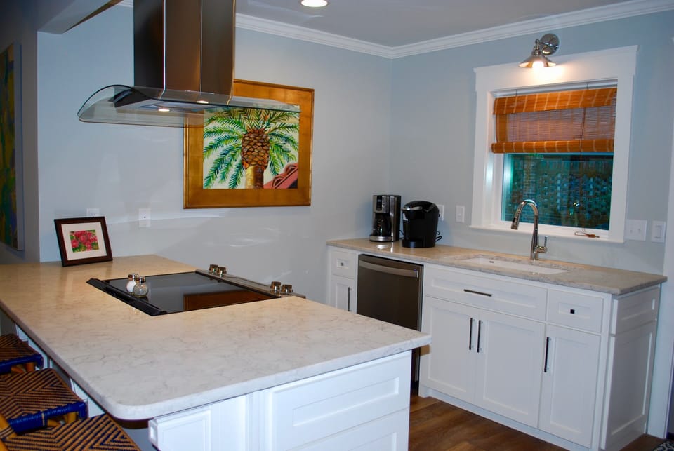 Kitchen with new appliances and beautiful quartz countertops.