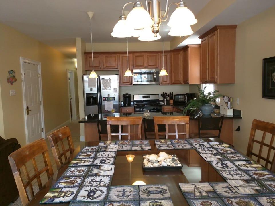 Open kitchen and dining area for socializing while prepping dinner.