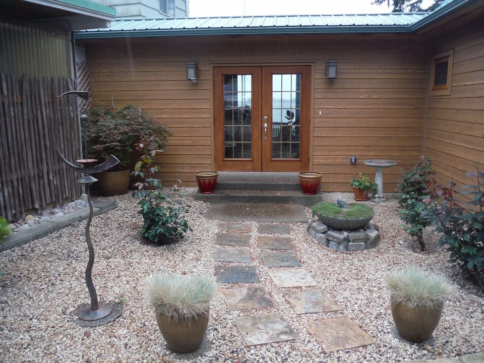 The home begins with a tranquil front entry.