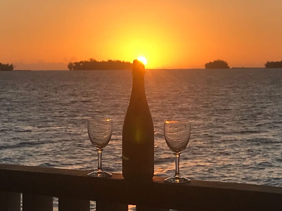 A DRINK ON THE BALCONY IN FRONT OF THE LAGOON