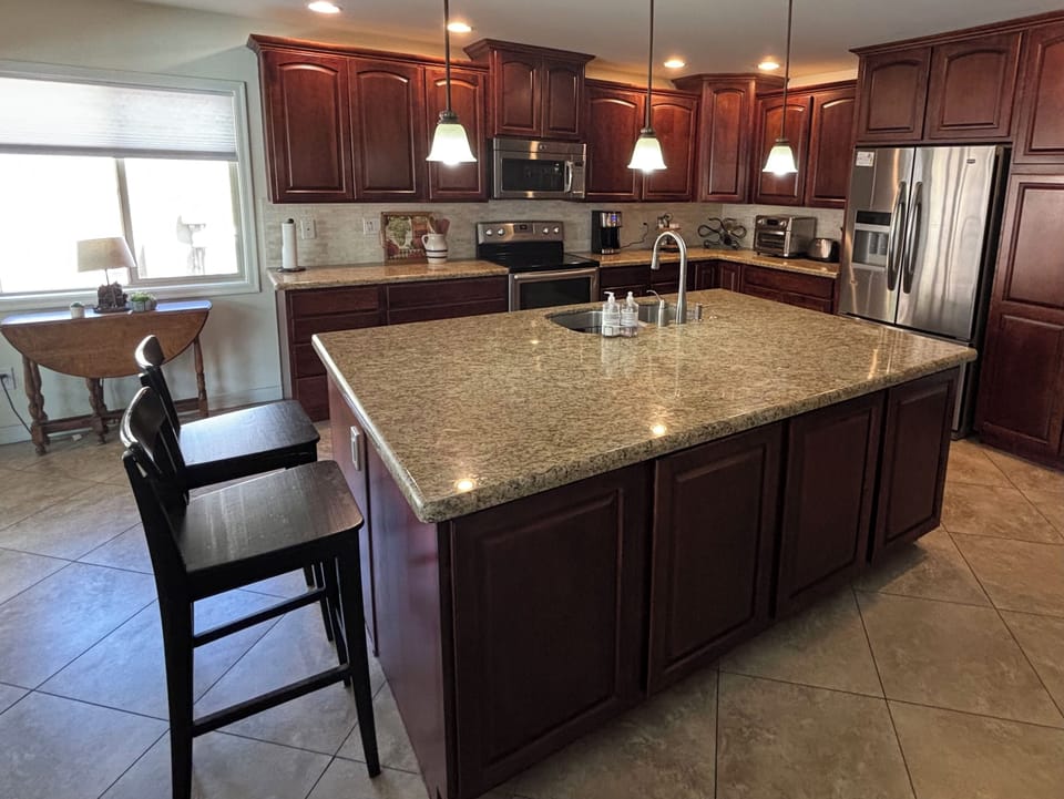 Spacious kitchen with a six foot island.