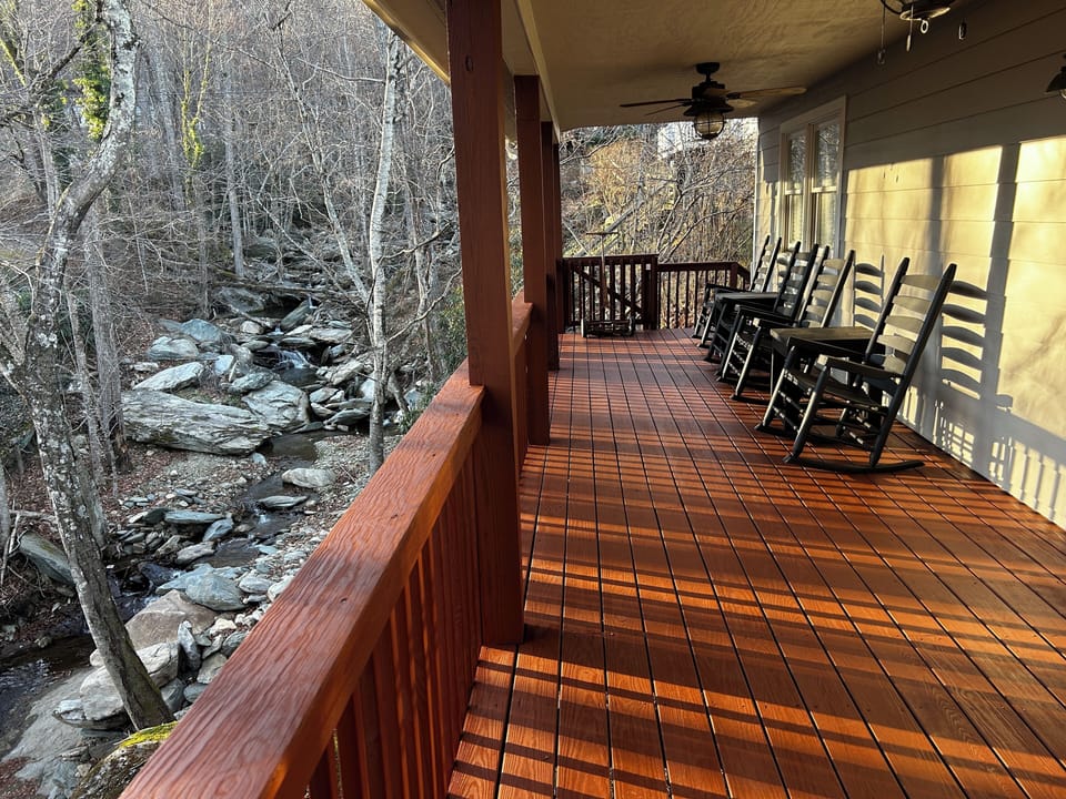 Covered back porch. Rocking chairs& ceiling fans. Overlooking rushing stream.