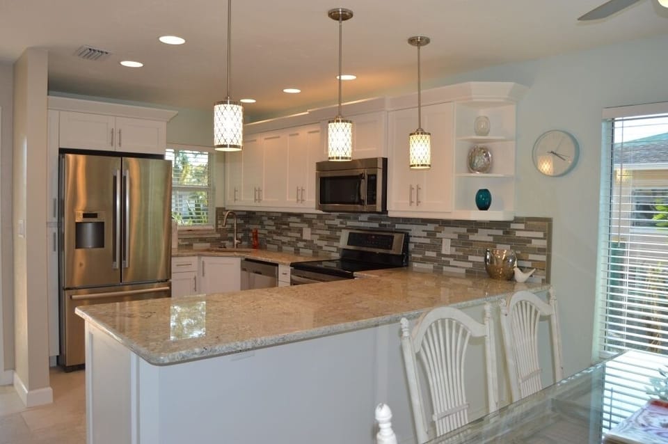 Renovated Kitchen: granite counters, stainless appliances, & solid wood cabinets