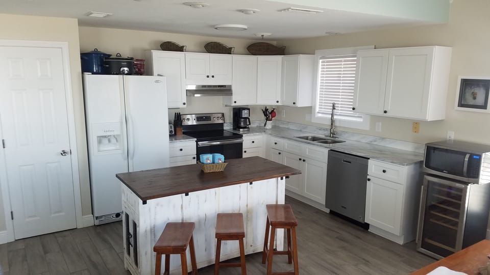 Brand new kitchen cabinets and counter top. Second fridge also (not in photo)