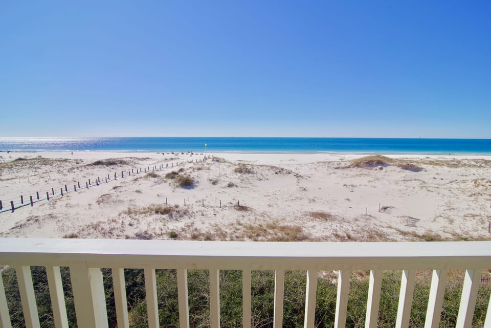 Beautiful, unobstructed, lower balcony view looking over the beach and gulf. 