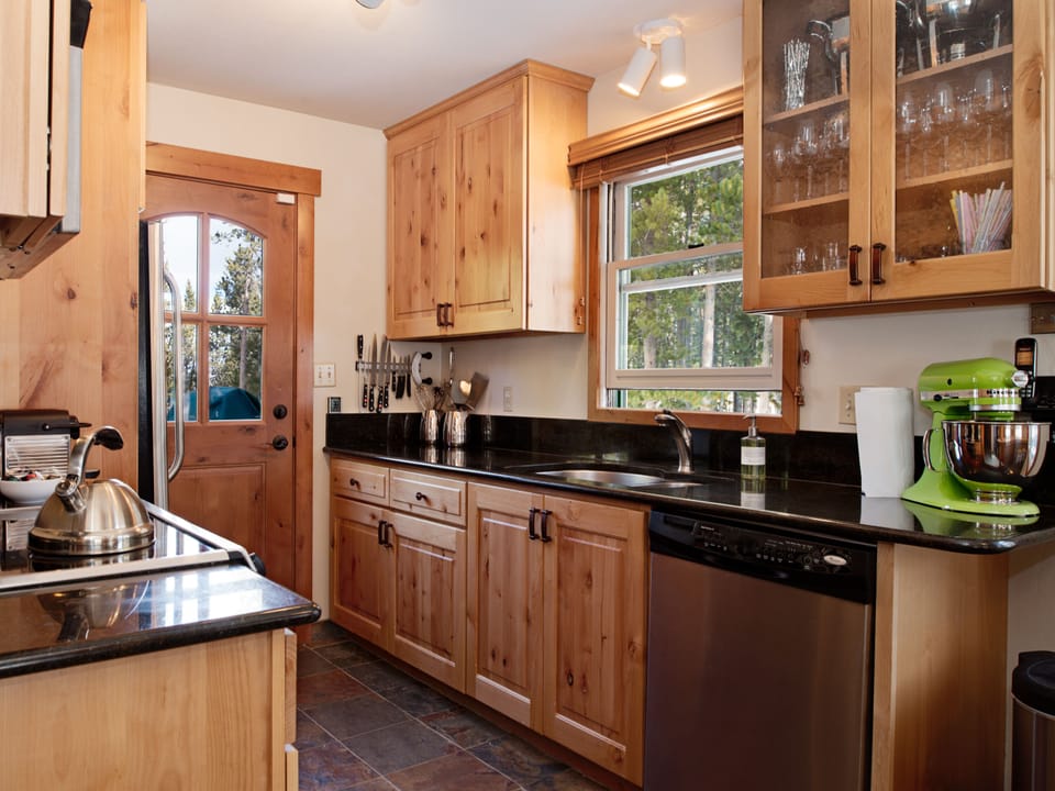Newly equipped kitchen full of quality bench top appliances and kitchenware