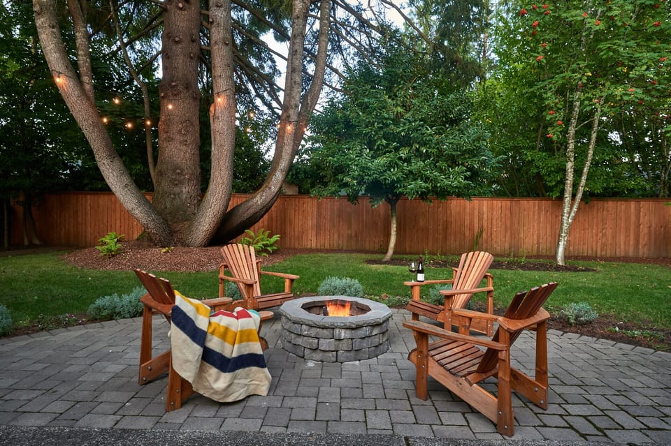 The backyard with fire pit is a great place to relax in the evenings.