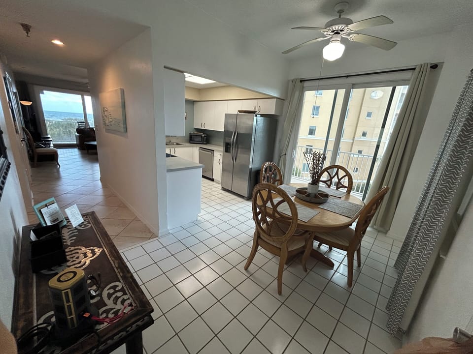 Kitchen dining area with balcony access