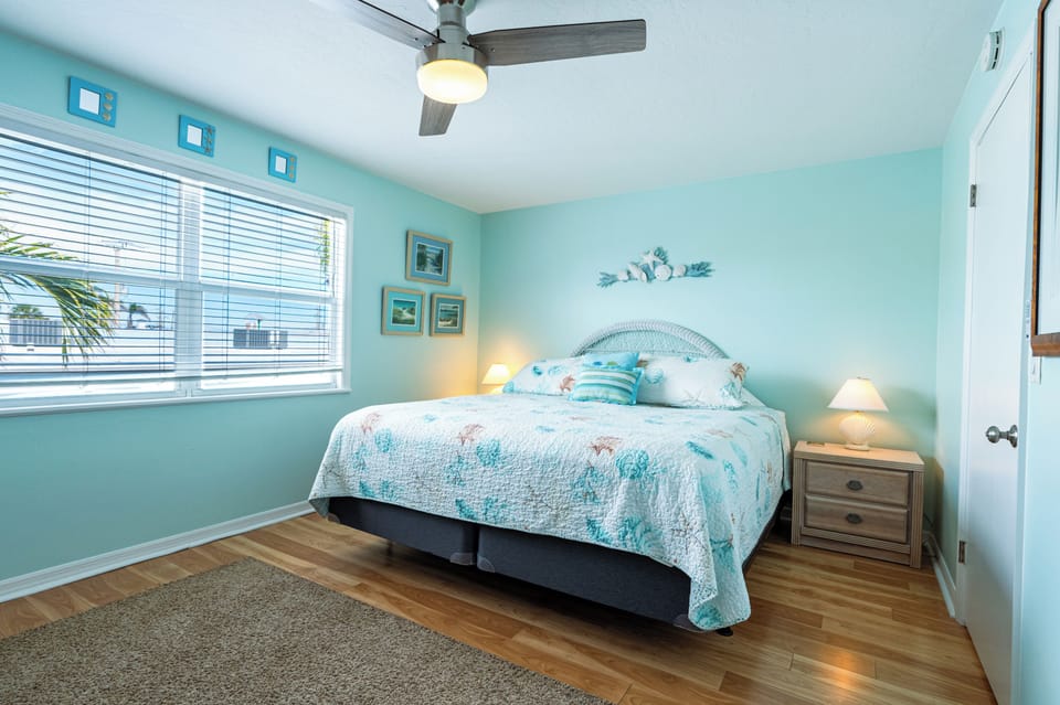 Upstairs master bedroom with king bed and walk-in closet