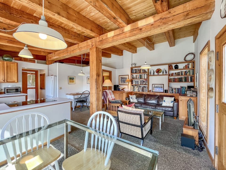 Kitchen, dining area and living room with a full sleeper sofa...