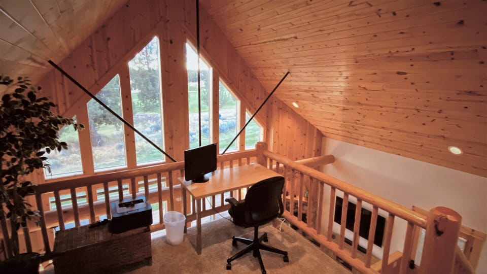 Office space in the loft with monitor and printer. 