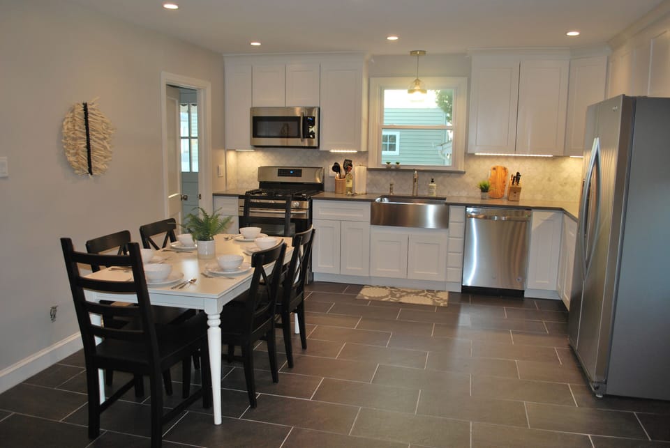 Stunning new kitchen with new appliances, farmhouse sink and quartz countertop