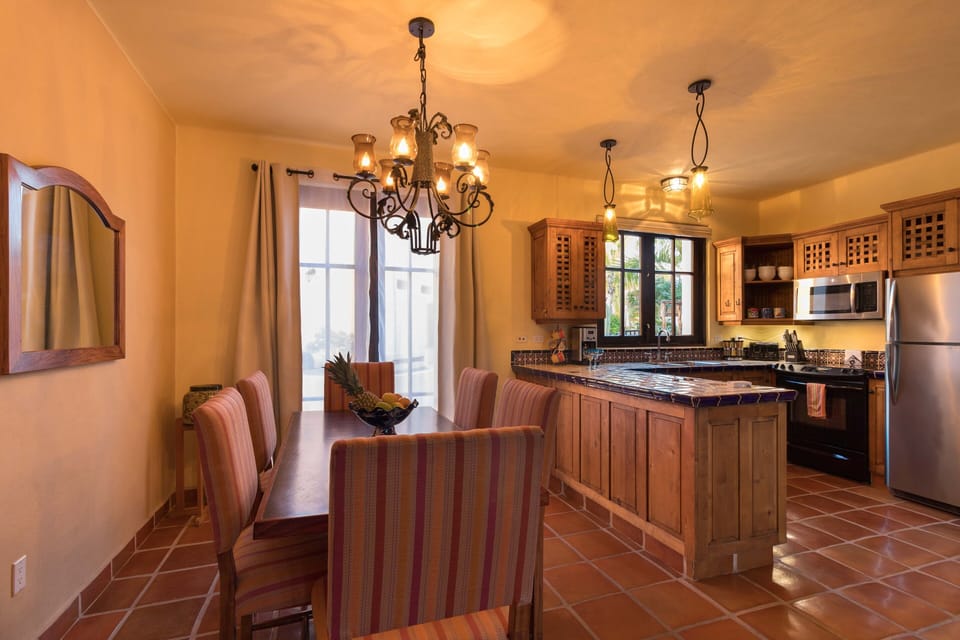 Dining seating for six with option for an evening breeze through French doors.