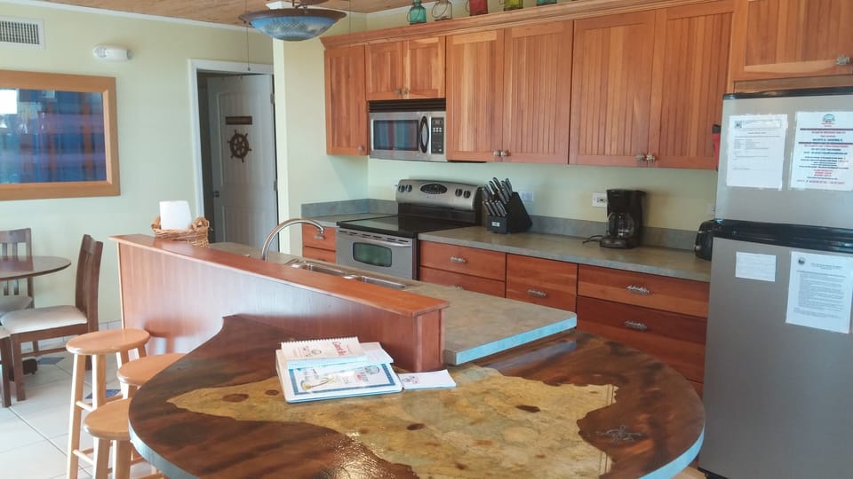 Notice the beautiful custom wood table attached to kitchen counter.