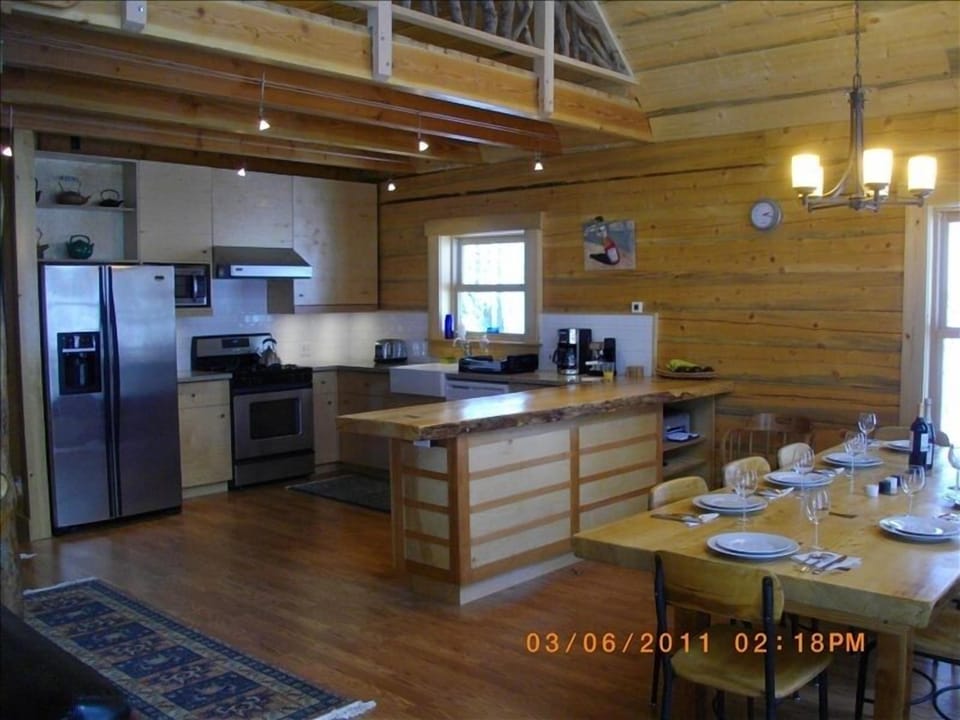 Unique crafted kitchen with Nakashima inspired dining table and wood working.
