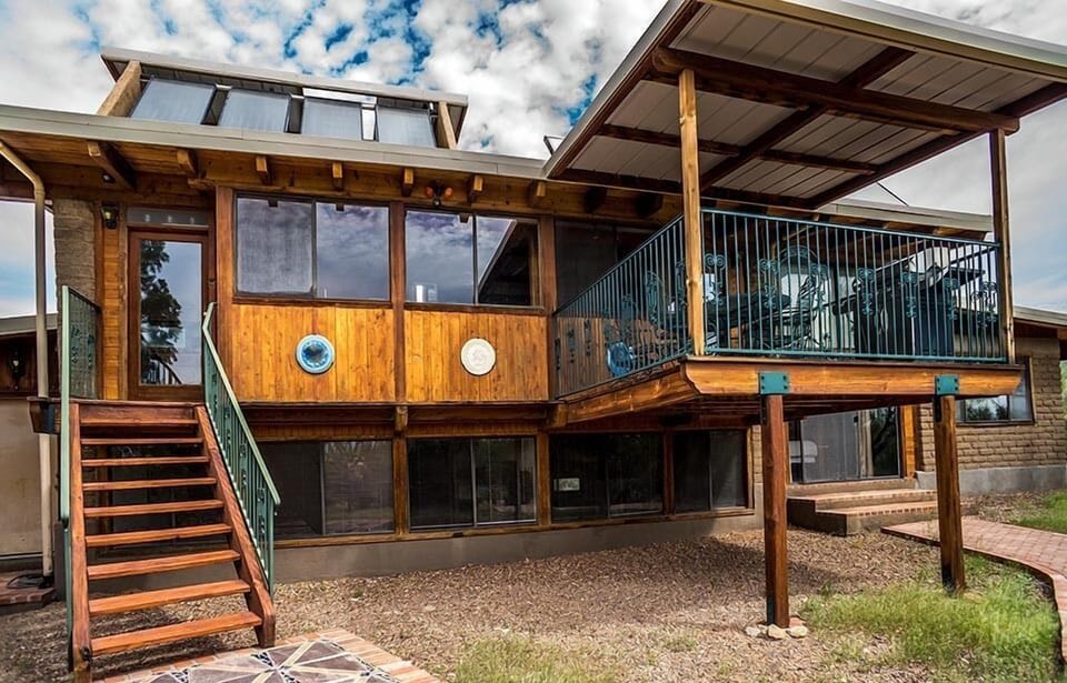 View of elevated deck and kitchen outside entrance.