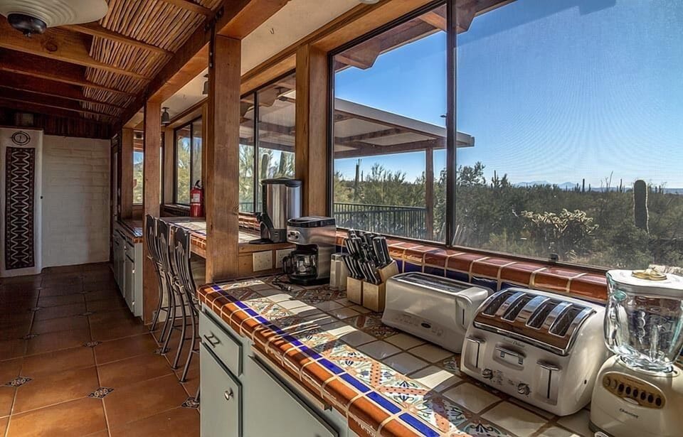 View from kitchen into dining room and deck area.