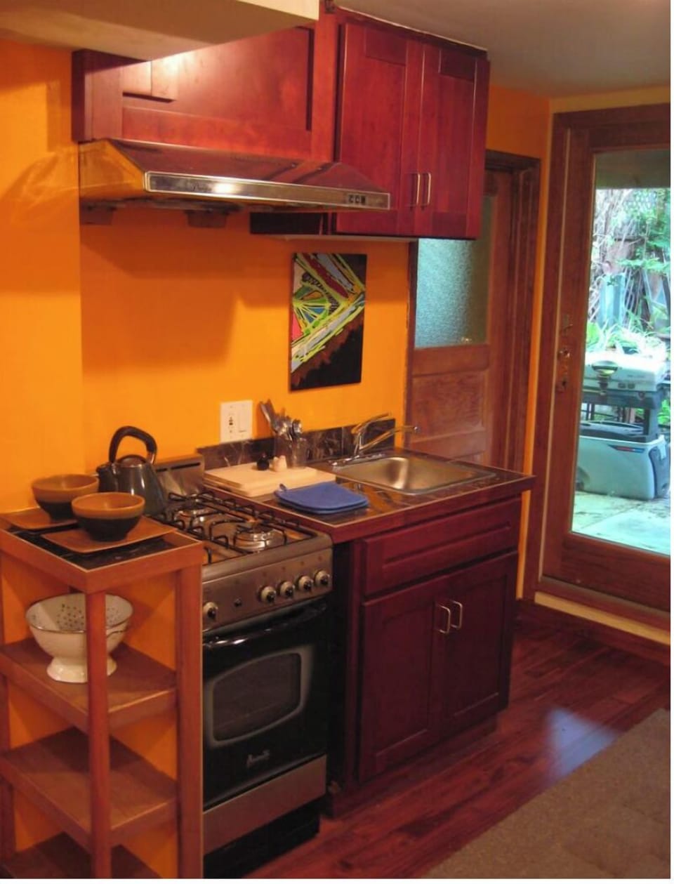 Efficient Kitchen, gas oven range, view of Private Backyard Patio Garden