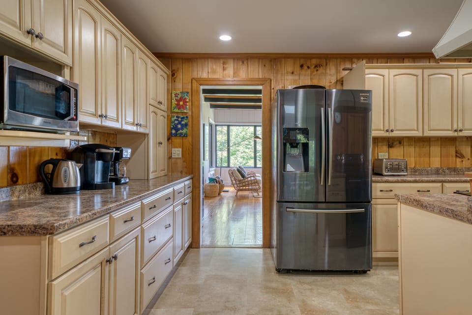 The stocked kitchen comes with a Keurig, a Mr. Coffee, and kettle