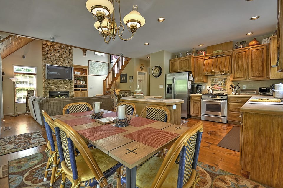 Dining room table for 6 in open kitchen area.